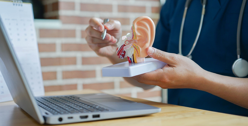 close up professional otolaryngologist explain and diagnose to patient by pointing on human ear anatomy about eardrum symptom for treatment and heal concept